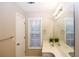 Clean bathroom with double vanity and window at 740 Abbotts Mill Ct, Johns Creek, GA 30097