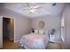 Bedroom with ceiling fan, neutral walls, and window blinds at 740 Abbotts Mill Ct, Johns Creek, GA 30097
