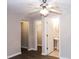 Bedroom with a ceiling fan, walk-in closet and private bathroom at 740 Abbotts Mill Ct, Johns Creek, GA 30097