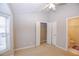 Spacious bedroom with a ceiling fan, walk-in closet and private bathroom at 740 Abbotts Mill Ct, Johns Creek, GA 30097