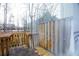 Back deck with wooden railings and access to a fenced yard at 740 Abbotts Mill Ct, Johns Creek, GA 30097