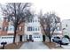 Charming townhome exterior featuring a private garage, brick accents, and a welcoming front entrance at 740 Abbotts Mill Ct, Johns Creek, GA 30097