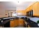 Modern kitchen with stainless steel appliances and light wood cabinets at 740 Abbotts Mill Ct, Johns Creek, GA 30097