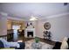 Open living room features a fireplace and hardwood floors at 740 Abbotts Mill Ct, Johns Creek, GA 30097