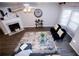 Spacious living room with fireplace and large windows at 740 Abbotts Mill Ct, Johns Creek, GA 30097
