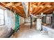 Unfinished basement with exposed beams and storage at 1171 Larch Ln, Decatur, GA 30033