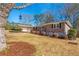 Ranch house with carport, yard, and tree at 1171 Larch Ln, Decatur, GA 30033