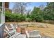 Brick patio with fire pit and comfortable seating at 1791 Walthall Nw Dr, Atlanta, GA 30318