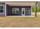 Covered back patio with concrete flooring at 458 Florence Rd, Douglasville, GA 30134