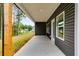 Covered back patio with concrete flooring at 458 Florence Rd, Douglasville, GA 30134