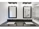 Double vanity bathroom with black framed mirrors at 458 Florence Rd, Douglasville, GA 30134