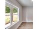 Simple bedroom with a large window and wood-look floors at 458 Florence Rd, Douglasville, GA 30134