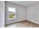 Bright bedroom with neutral walls and wood-look flooring at 458 Florence Rd, Douglasville, GA 30134
