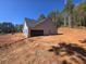 Gray siding home with dark brown garage door at 458 Florence Rd, Douglasville, GA 30134