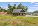 Single story home with dark exterior and light trim at 458 Florence Rd, Douglasville, GA 30134
