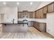 Modern kitchen with dark wood cabinets and black countertops at 458 Florence Rd, Douglasville, GA 30134