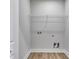 Simple laundry room with wire shelving at 458 Florence Rd, Douglasville, GA 30134