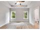 Spacious main bedroom with two windows and ceiling fan at 458 Florence Rd, Douglasville, GA 30134