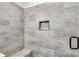 Shower with grey tile and built in seat at 458 Florence Rd, Douglasville, GA 30134