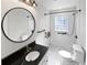Updated bathroom with a walk-in shower and subway tile at 1048 Plainview Dr, Marietta, GA 30066