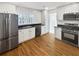 Modern kitchen with stainless steel appliances and white cabinets at 1048 Plainview Dr, Marietta, GA 30066