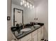 Modern bathroom with double sinks, granite countertops, and updated fixtures at 2587 Alvecot Cir, Atlanta, GA 30339