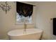 Relaxing bathroom with freestanding tub and gold fixtures at 2587 Alvecot Cir, Atlanta, GA 30339