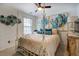 Spacious bedroom with a large bed, artwork, and decorative accents at 2587 Alvecot Cir, Atlanta, GA 30339