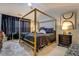 Spacious bedroom with canopy bed and neutral decor at 2587 Alvecot Cir, Atlanta, GA 30339