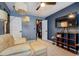 Bright bedroom with a sitting area, walk-in closet, and large TV at 2587 Alvecot Cir, Atlanta, GA 30339