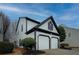 White two-story house with a two-car garage and landscaping at 2587 Alvecot Cir, Atlanta, GA 30339