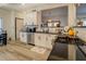 Modern kitchen with white cabinets, black countertops, and stainless steel appliances at 2587 Alvecot Cir, Atlanta, GA 30339