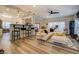 Open living space with L-shaped sectional sofa, fireplace, and hardwood floors at 2587 Alvecot Cir, Atlanta, GA 30339