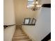 Elegant staircase with chandelier and neutral color palette at 2587 Alvecot Cir, Atlanta, GA 30339