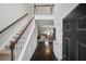 Bright and spacious entryway with staircase and hardwood floors at 2915 Saint Andrews Ct, Cumming, GA 30041