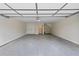 Attached two-car garage with storage and stairs at 622 Bellemeade Nw Ave # 7, Atlanta, GA 30318