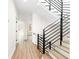 Light hardwood floors and modern staircase at 622 Bellemeade Nw Ave # 7, Atlanta, GA 30318