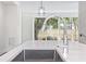 Modern kitchen sink and faucet with a view to the backyard at 622 Bellemeade Nw Ave # 7, Atlanta, GA 30318