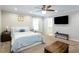 Main bedroom with plush carpet and built-in TV stand at 854 Carlisle Rd, Stone Mountain, GA 30083