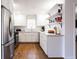 Modern kitchen with stainless steel appliances and white cabinets at 854 Carlisle Rd, Stone Mountain, GA 30083