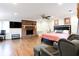 Main bedroom with hardwood floors, fireplace, and sitting area at 854 Carlisle Rd, Stone Mountain, GA 30083