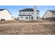 Spacious backyard with a view of the home's exterior at 520 Harmony Way, Locust Grove, GA 30248