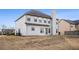 View of the back of the home showcasing the large backyard at 520 Harmony Way, Locust Grove, GA 30248