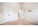 Carpeted bedroom with high ceilings and closet space at 520 Harmony Way, Locust Grove, GA 30248