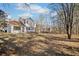 Large backyard with mature trees and grassy area at 4496 Whitt Station Nw Run, Acworth, GA 30101