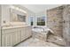 Updated bathroom with a soaking tub and walk-in shower at 4496 Whitt Station Nw Run, Acworth, GA 30101