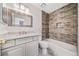 Clean bathroom with updated vanity and stone tile shower at 4496 Whitt Station Nw Run, Acworth, GA 30101