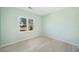 Light green bedroom with wood-look floors and a window view at 4496 Whitt Station Nw Run, Acworth, GA 30101
