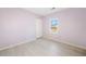 Light purple-walled bedroom with wood-look floors and a window view at 4496 Whitt Station Nw Run, Acworth, GA 30101