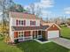 Two-story house with red shutters and a brick facade at 4496 Whitt Station Nw Run, Acworth, GA 30101